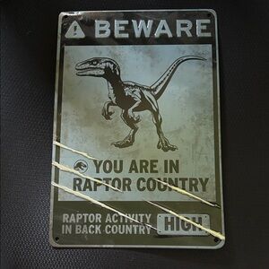 Raptor Country Warning Metal Sign - Black and Gray. Fun in kids room.